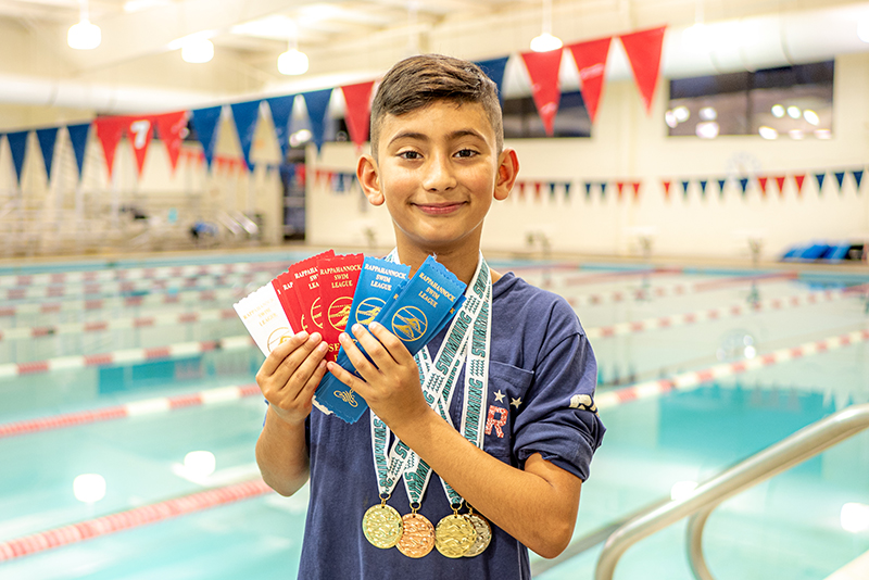 swimmer with medals